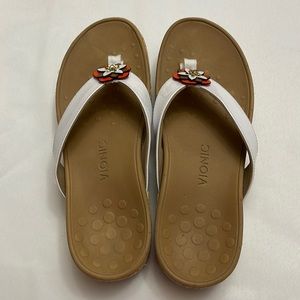 Cute comfy sandals with white straps and a flower. Good for spring/summer!